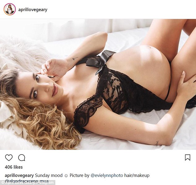 Robin Thicke's girlfriend April Love Geary puts her large baby bump on display while wearing black lingerie as she celebrates being 36 weeks along